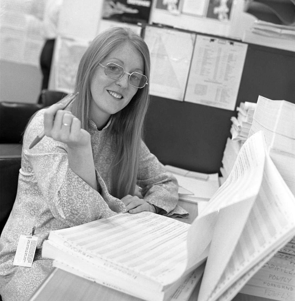 Margaret Hamilton with computer sheets, 1973.