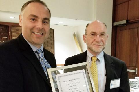 Almir Davis of Draper received the Boston Patent Law Association’s 2017 Top Honoree Award from George Jakobsche, patent attorney at Sunstein Kann Murphy & Timbers. Photo credit: Boston Patent Law Association.