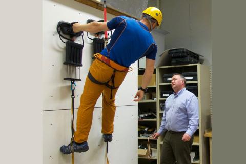 Z-Man co-developer David Carter, of Draper, instructs Andy Torbet on the finer points of the Z-Man climbing system. 