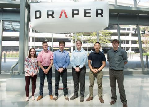 Draper’s STRATUS team members are (left to right) Aisling McEleney, Matthew Sanford, Nate Robillard, Scott Young, Erik Shing and Paul Long. They launched their lighter-than-air vehicle inside Draper’s Atrium this summer. (Not shown are George Gillespie an